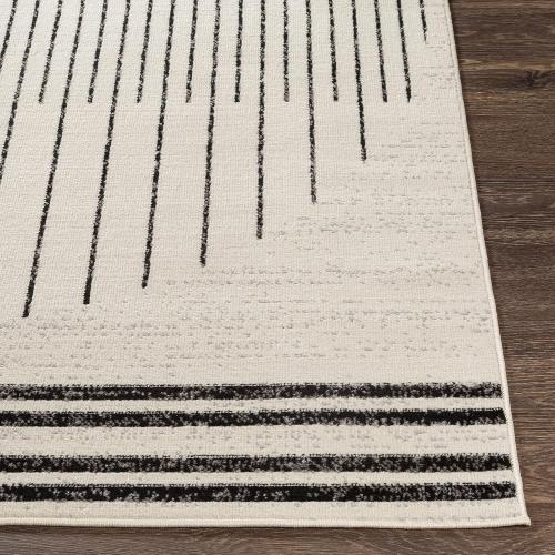 Présentation de Tapis géométrique scandinave noir, blanc, gris, design bohème en situation